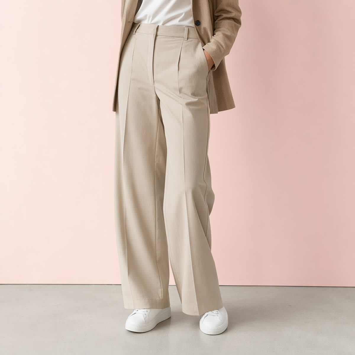 White sneakers with a tailored suit and trousers, smart-casual look